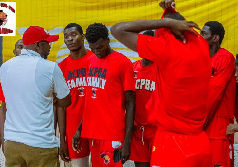 A coach instructing a young player